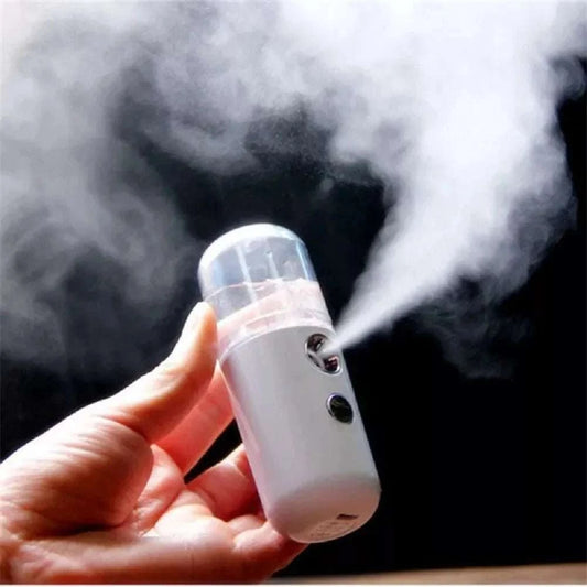 USB Mist Facial Sprayer emitting fine mist for skin hydration and rejuvenation.